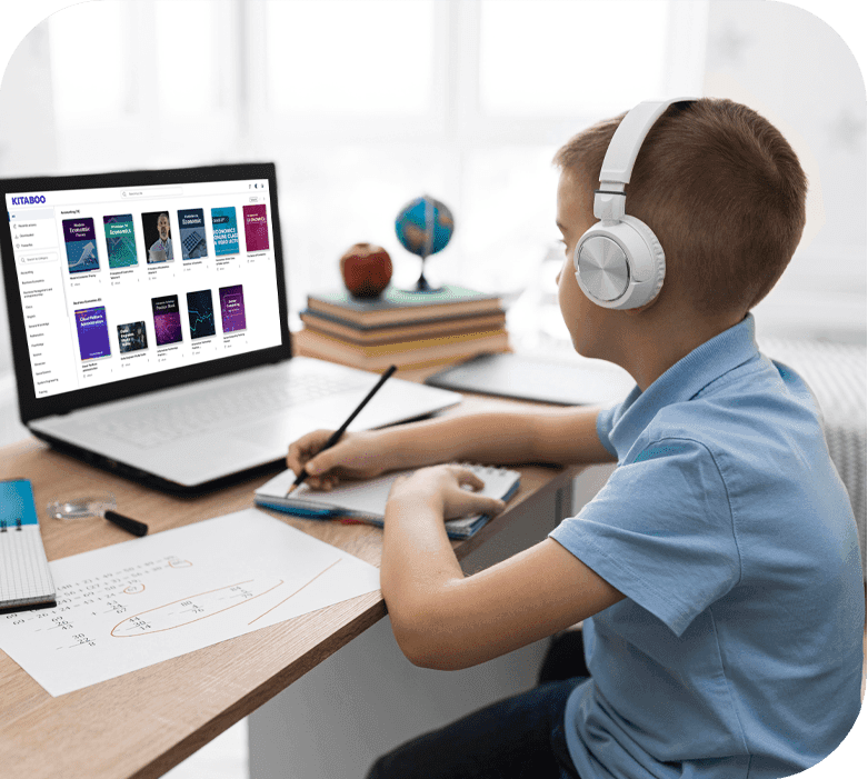A learner using headphones and a digital textbook library on a laptop